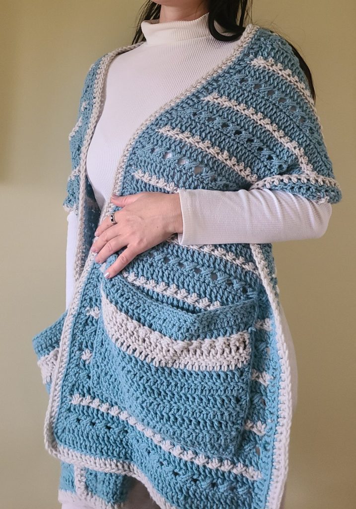 The Beautiful Crochet Pocket Shawl worn by a woman