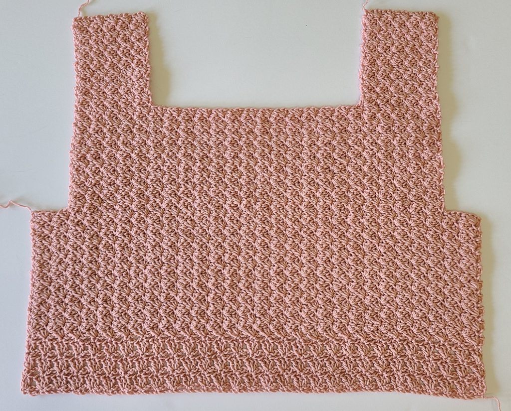 Detailed view of the back panel of the Malvina Crochet Crop Top showing openwork stitches