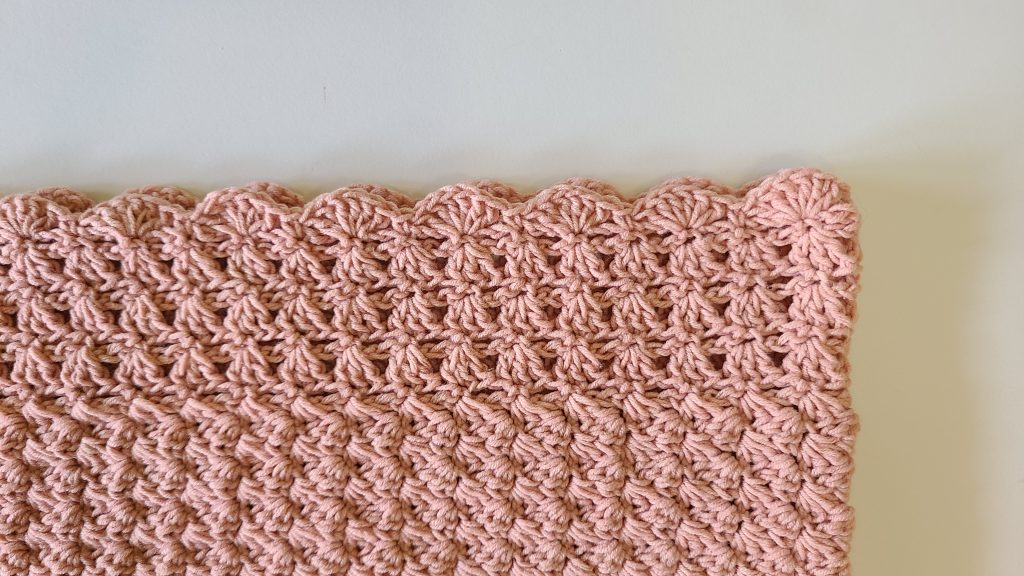 Close-up of the bottom border of the Malvina Crochet Crop Top showing lace stitch detail