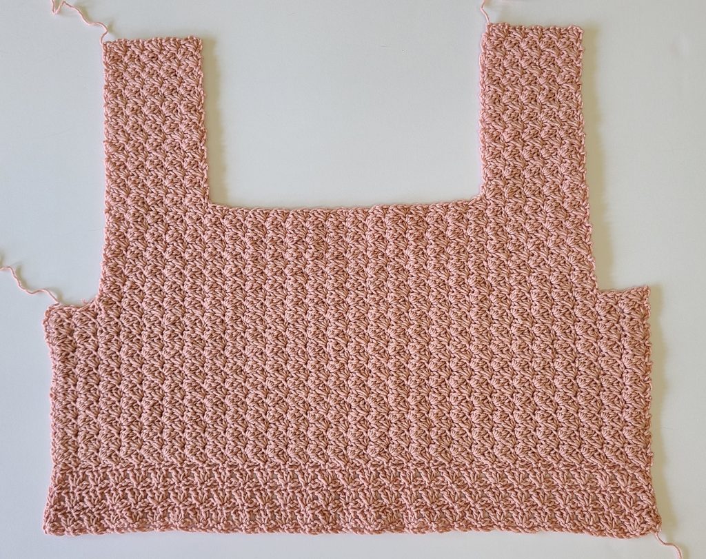 Full front panel of the Malvina Crochet Crop Top showing delicate lace stitch pattern
