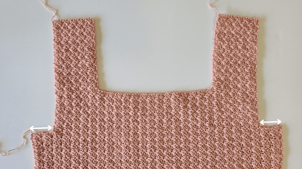 Front half panel of the Malvina Crochet Crop Top showing lace stitch details and straps