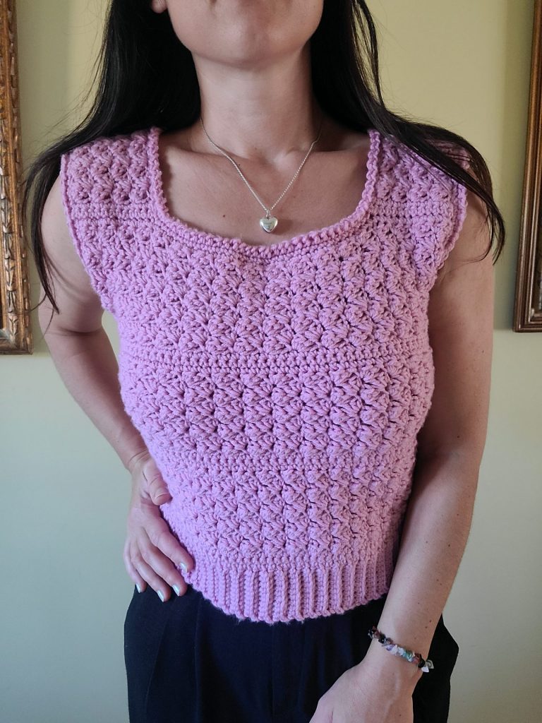 crochet pink vest worn by a woman
