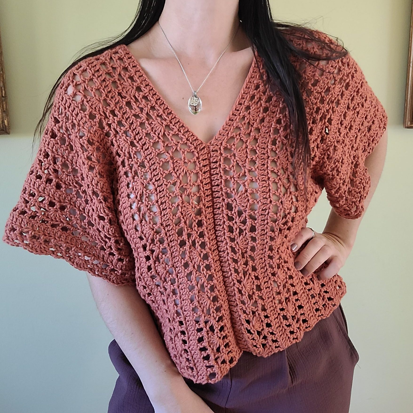 Handcrafted crochet lace top with delicate openwork pattern and boho-inspired detailing.