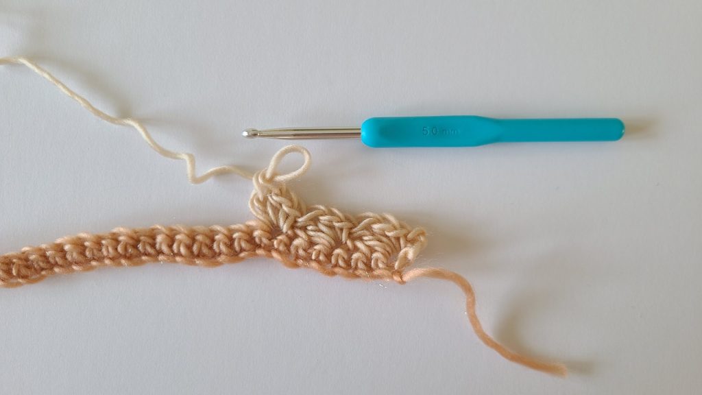 Close-up of the start of Row 2 of the Amalya Crochet Scarf showing stitch placement and pattern progression