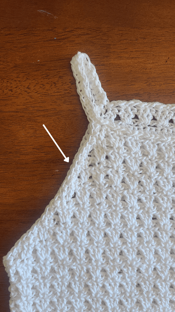 Crochet tank top strap detail showing clean edge finish