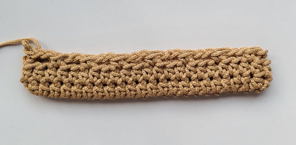 “Third row of the crochet crossbody bag base fully completed”