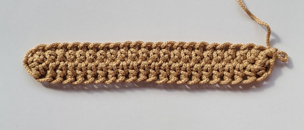 “Full first row of the crochet crossbody bag base completed”