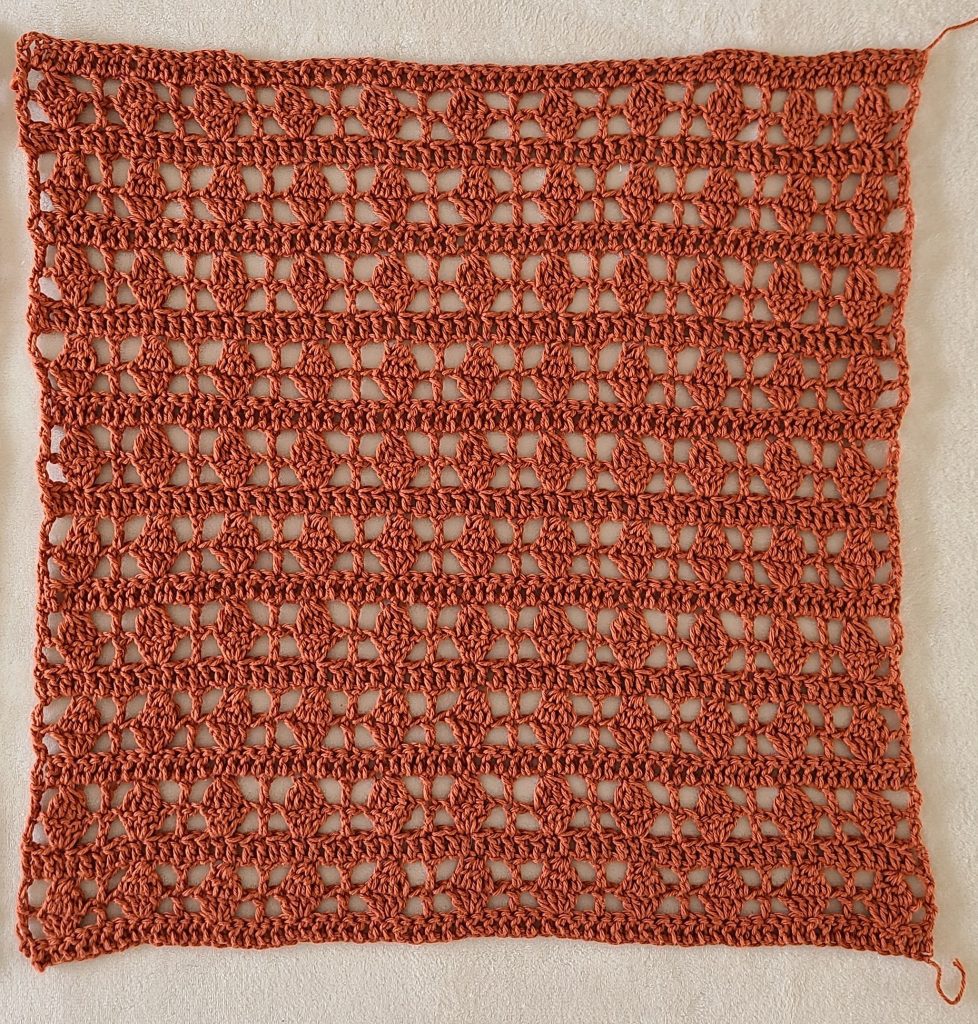 Back panel of the Galena crochet lacy top laid flat