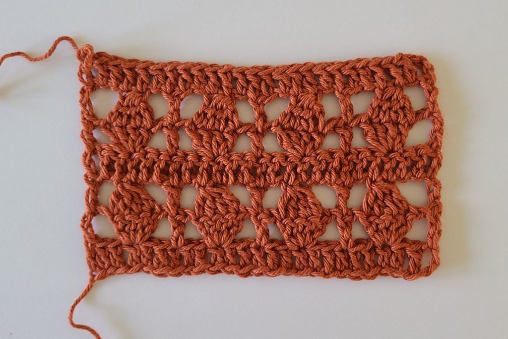 Gauge swatch for the Galena crochet lacy top showing stitch and row measurements