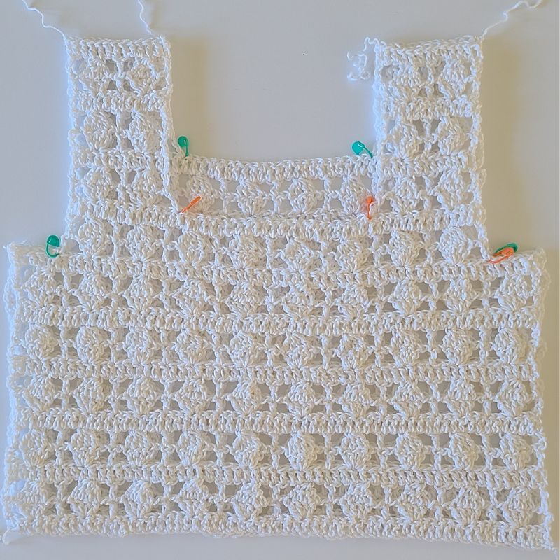 Assembling Ilsa crochet lacy crop top panels with straps and side seams