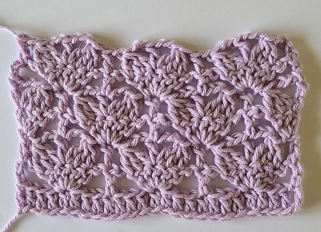 Close-up of lace stitch swatch used in the Lavinia Crochet Lacy Top pattern.