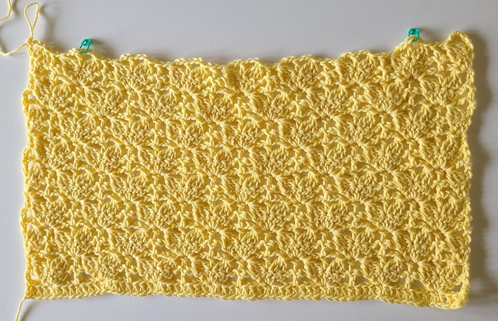 Flat yellow crochet panel worked in textured stitch pattern for the Lorelay crochet crop top.