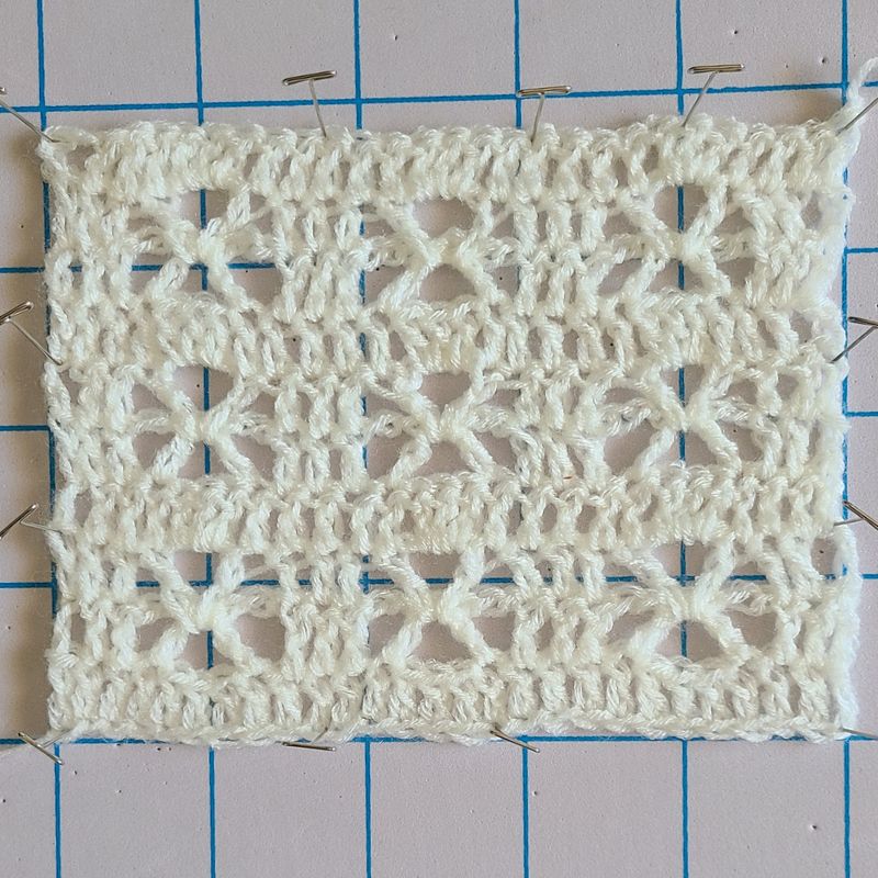 Crochet lacy sweater stitch swatch showing openwork pattern and texture