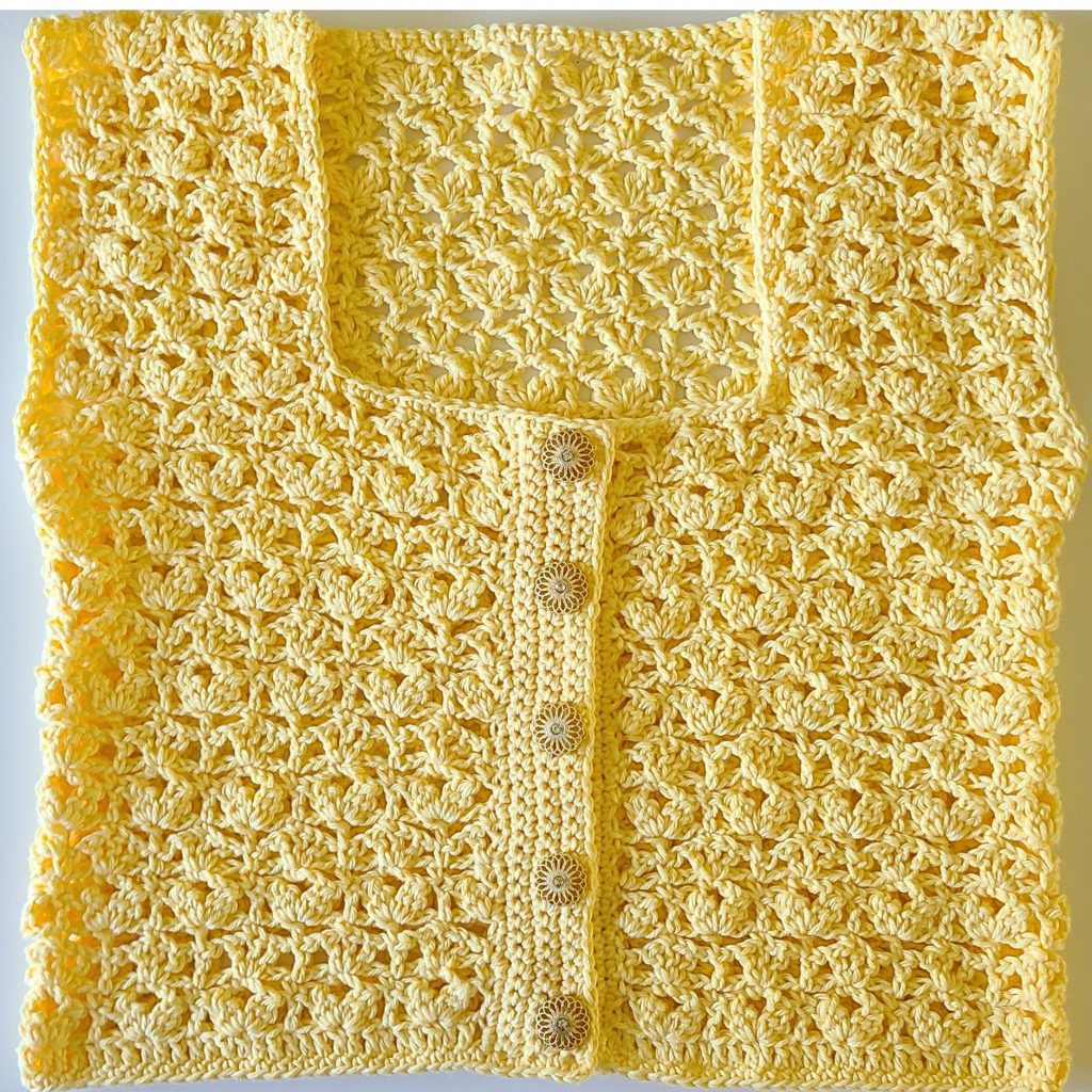 finished crochet vest laid flat showing full shape and design
