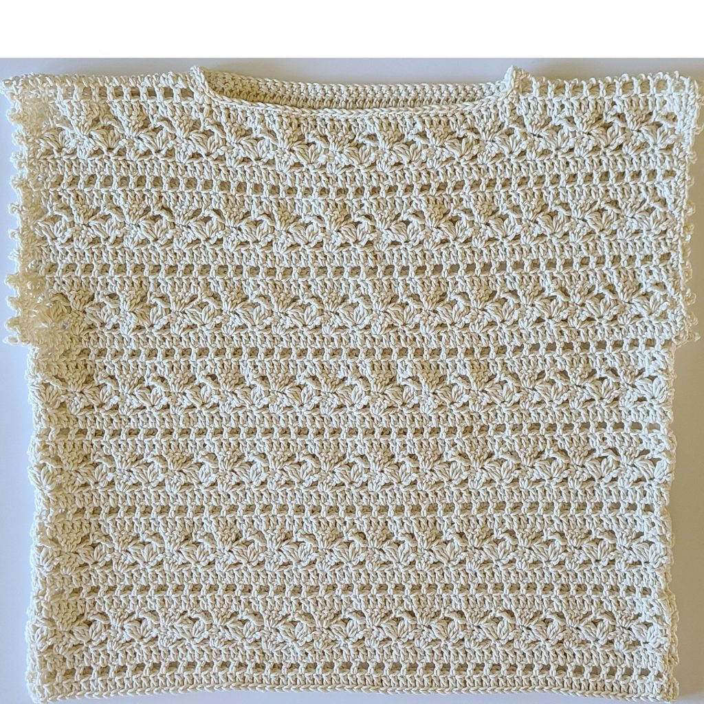 Finished summer lace crochet top worn by a model showing fit and drape