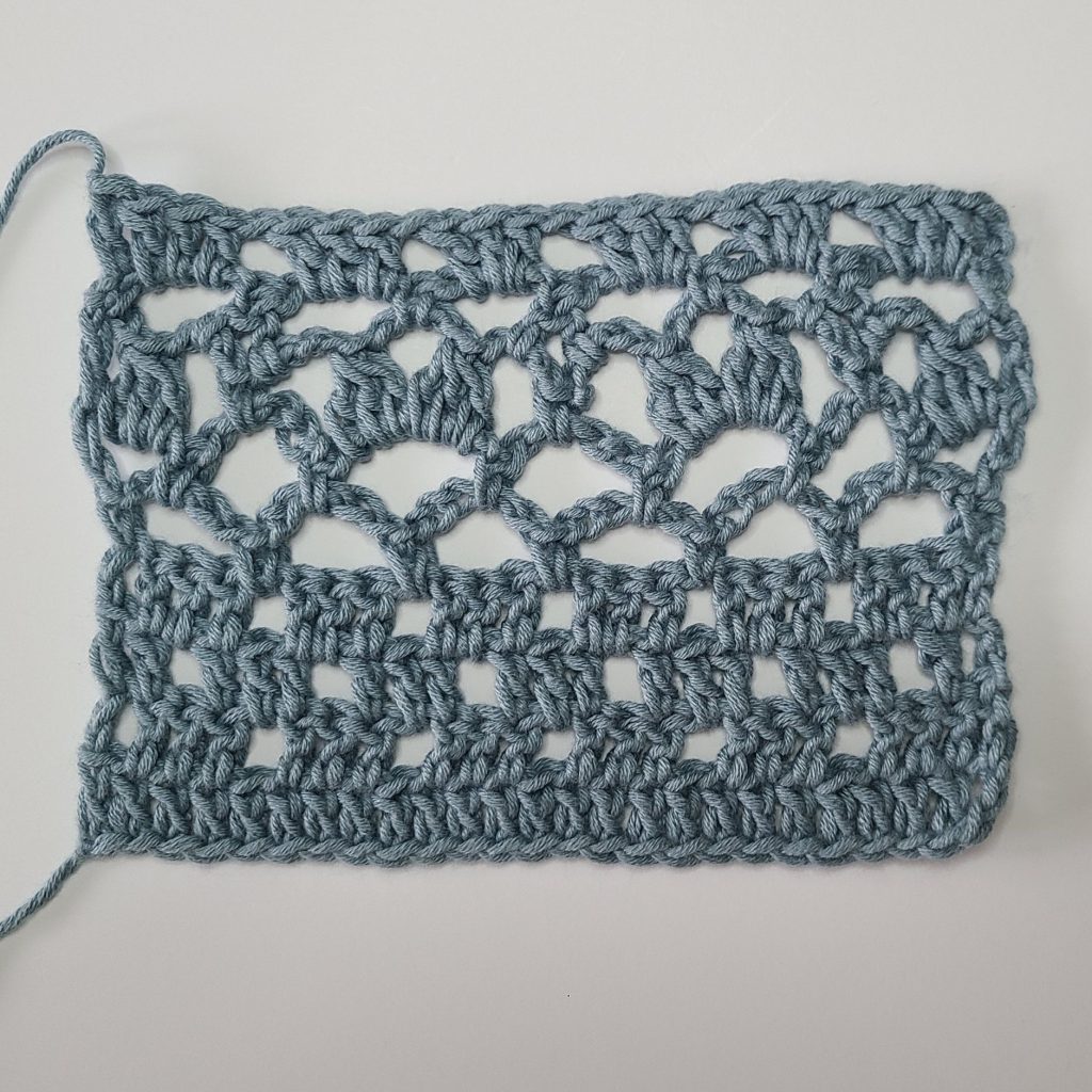crochet lace stitch swatch showing openwork pattern for crochet lace top