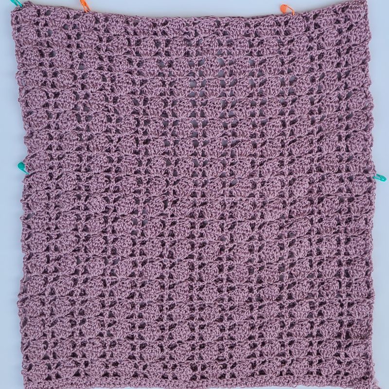 Crochet lace top panels with stitch markers ready for assembly