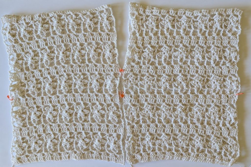 Two identical crochet panels for the Della Crochet Lace Top laid flat before seaming, showing the V-neck openings.