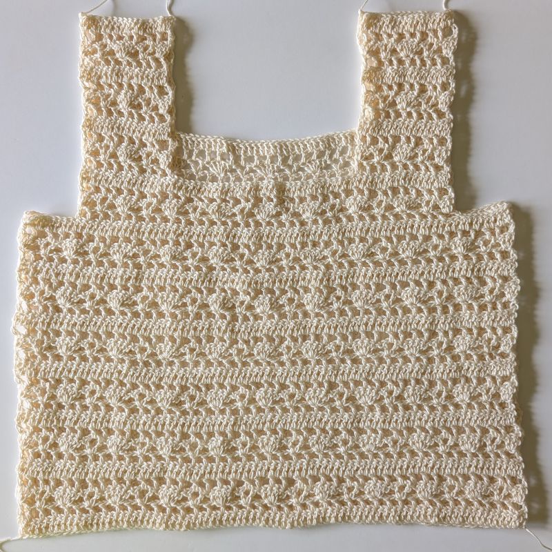 Front and back crochet panels placed together before sewing the shoulders and sides.