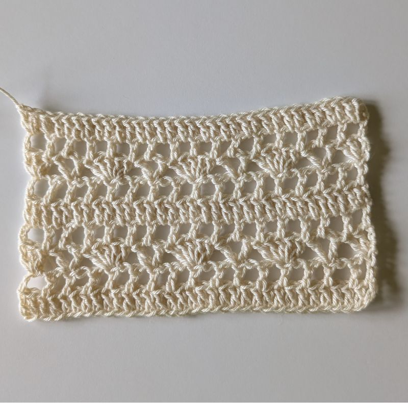 Gauge swatch for the Aviana Crochet Lace Top showing the lace stitch pattern used in the project.