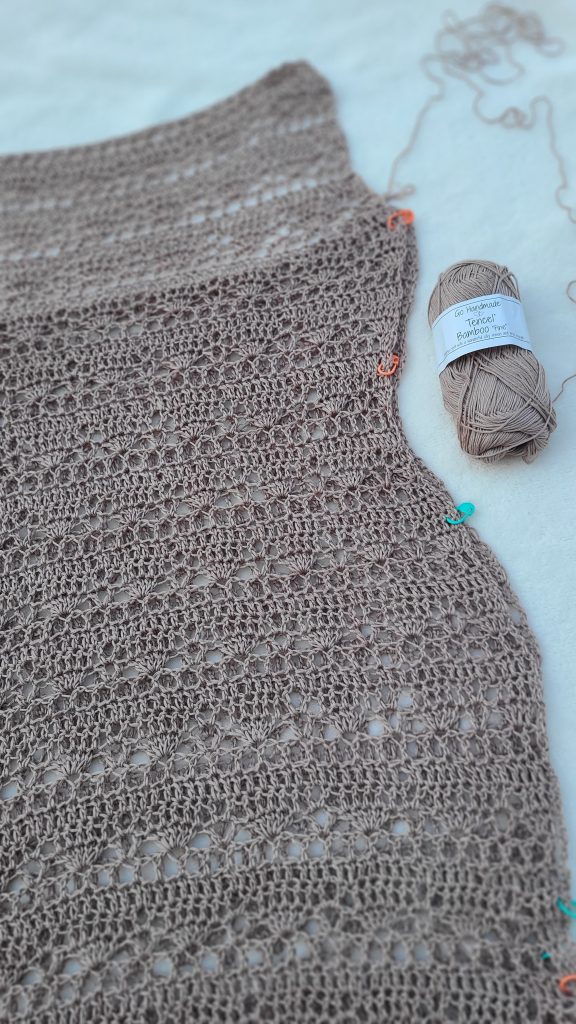 Front and back panels of the Sorelya crochet dress aligned and ready to be sewn together at the sides and shoulders.