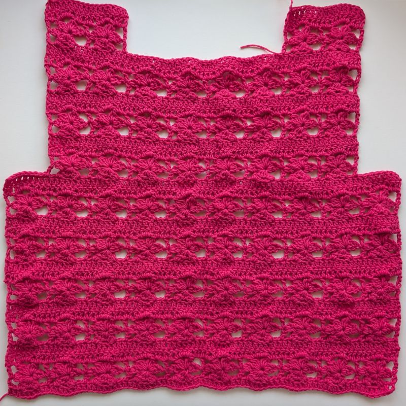 Back panel of the Zana Crochet Top featuring the same floral stitch pattern and shoulder shaping.