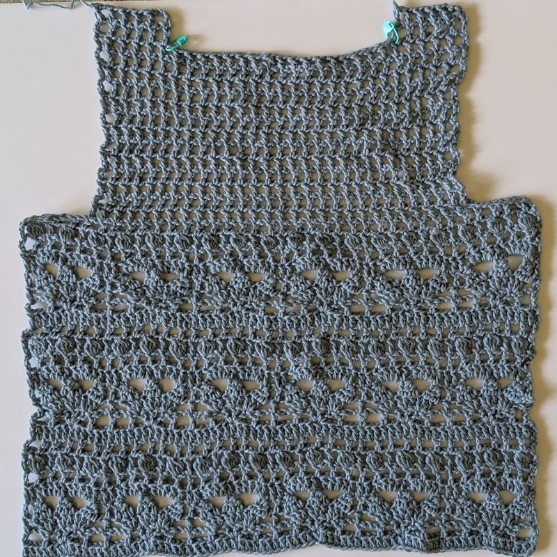 Back panel of the Allana Crochet Lace Top before assembly showing the mesh yoke and lace stitch pattern.
