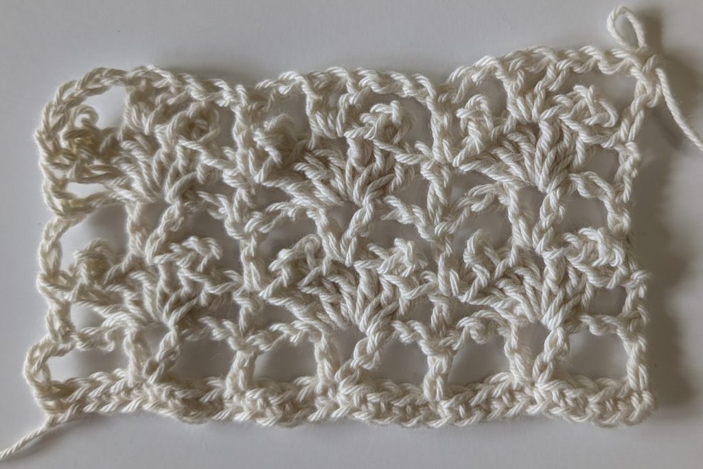 Crochet gauge swatch showing the lace stitch used for the Zalina Crochet Top