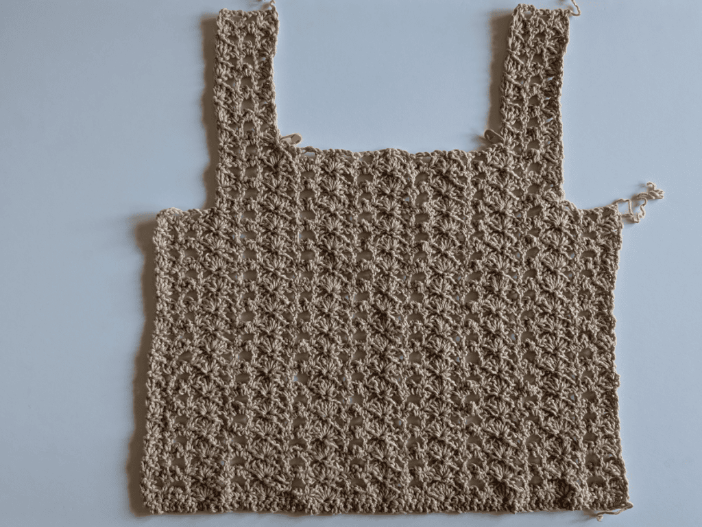 Front panel of the Danna Crochet Top laid flat